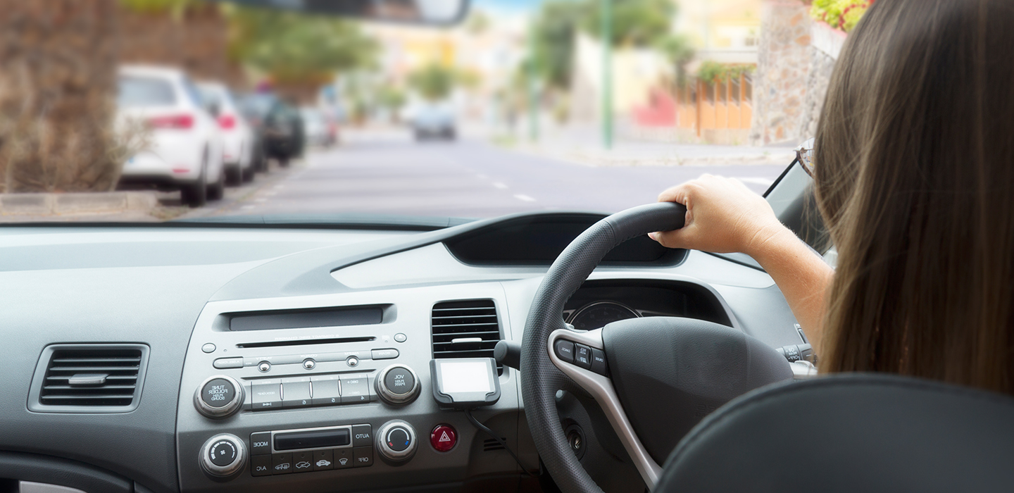 A learner driver behind the steering wheel