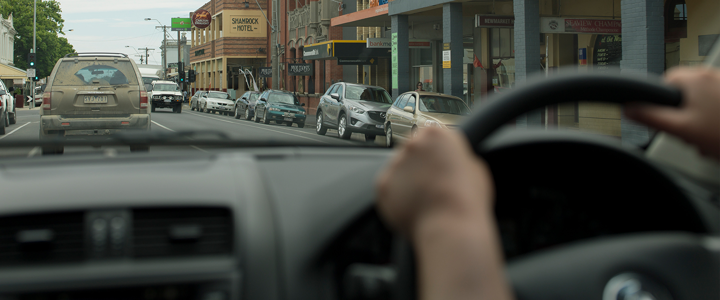 Watching the road ahead from behind the steering wheel